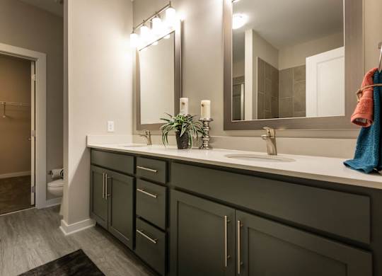 A Bathroom With a Large Mirror at The Aster Cary, North Carolina