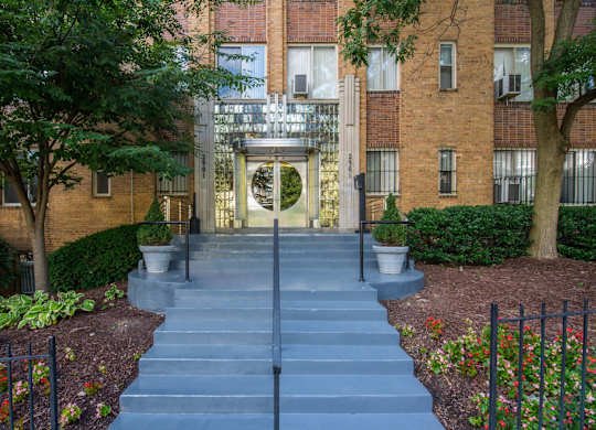 A set of stairs leads to a building entrance.