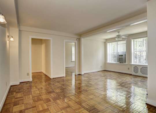 Spacious living room with hardwood floors at Tivoli Gardens Apartments, Washington