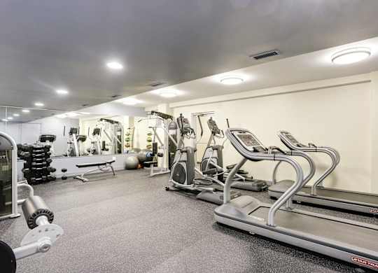 Fitness center with cardio and strength equipment at Tivoli Gardens Apartments, Washington, 20010