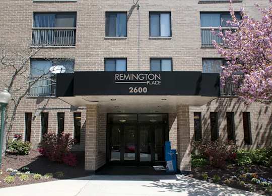 The front of a building with the name Remington Place on it.