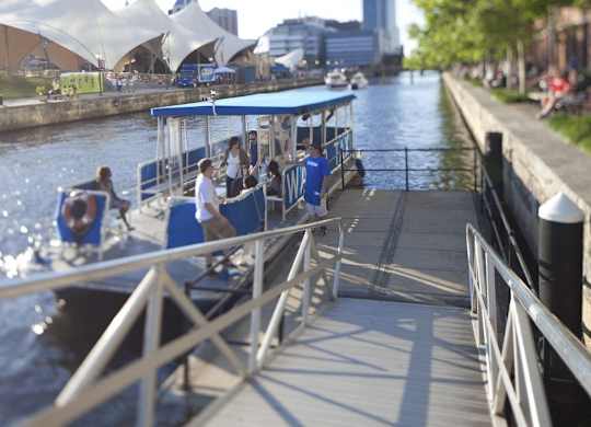 Waterfront with passenger boat and walkway at 1305 Dock Apartments, Baltimore, 21231