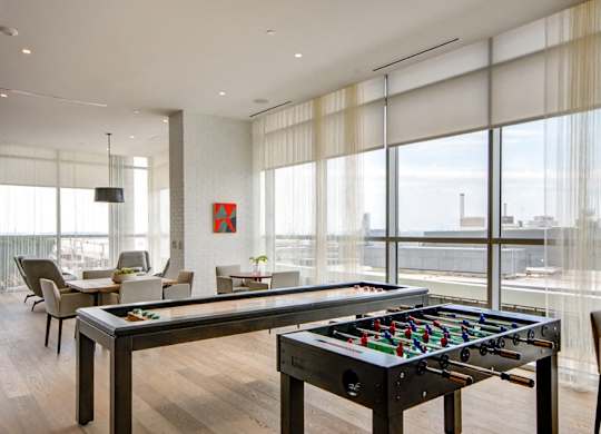 Recreation room with pool table and foosball at 1405 Point Apartments, Maryland