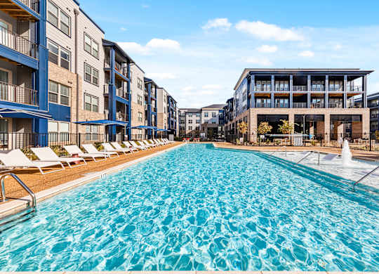 A large swimming pool in front of apartment buildings at Preston Ridge in Cary, North Carolina.