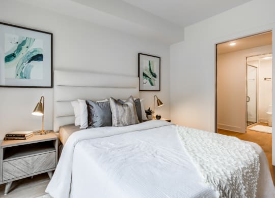 a bedroom with a large bed and a mirror at Rialto, Washington, DC 20002