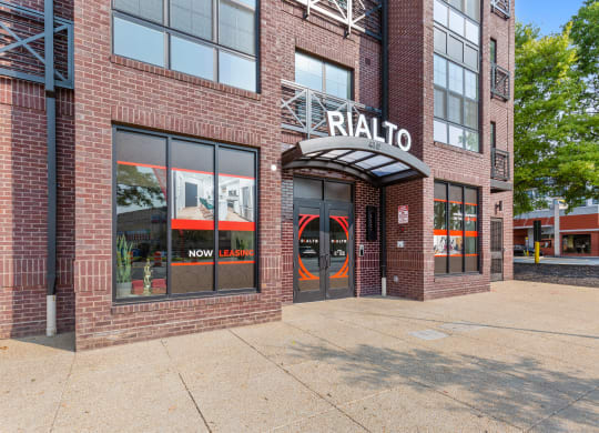 a brick building with a sign on the front of it at Rialto, Washington, DC 20002