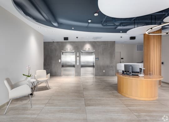 a lobby with a reception area and a reception desk