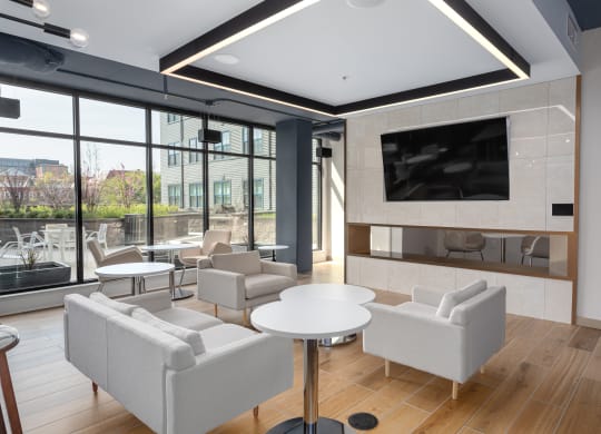 a rendering of a living room with chairs and a television