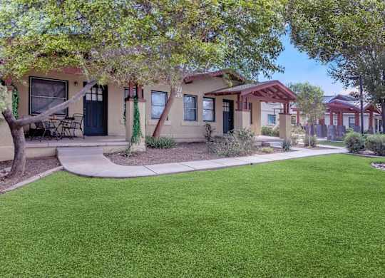 A row of houses with green lawns in front at Roosevelt Commons Apartments, Phoenix, 85003