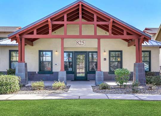 A house with a red roof and the number 825 on it at Roosevelt Commons Apartments, Arizona