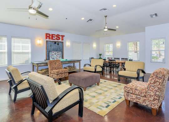 A living room with a sign at Roosevelt Commons Apartments, Phoenix