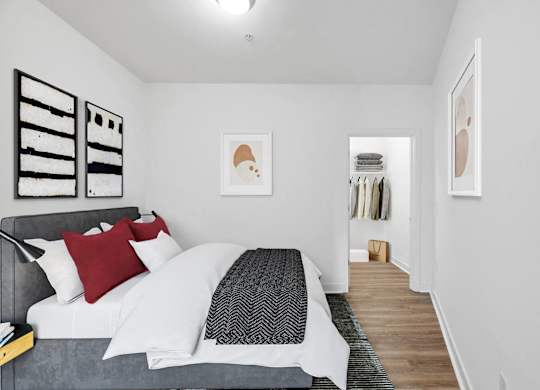 a bedroom with a bed and a closet at Fort Totten Square, Washington