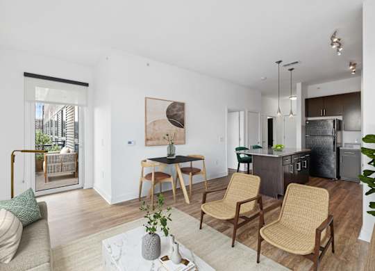a living room with a couch and a table with chairs at Fort Totten Square, Washington DC