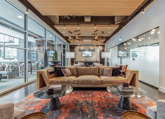 a living room with a couch and tables at South and Hollis, Charlotte