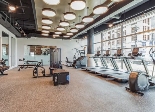 a fitness room with treadmills and other exercise equipment at South and Hollis, Charlotte, NC, 28209