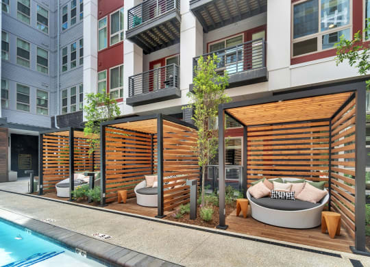 a communal area with a pool and a city building at South and Hollis, Charlotte, NC