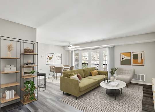 A living room with a green couch and a coffee table.