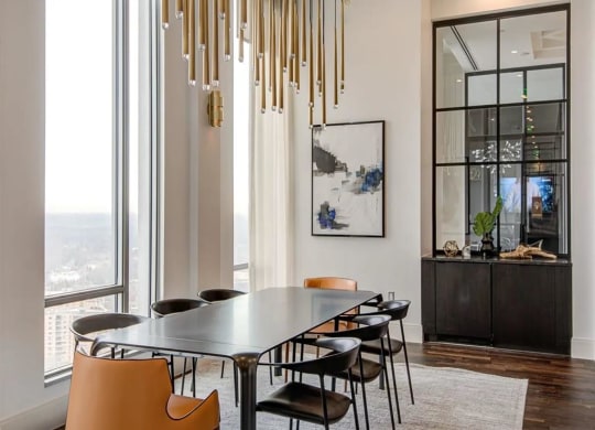 a dining room with a large table and chairs at The Boro, Tysons, 22102
