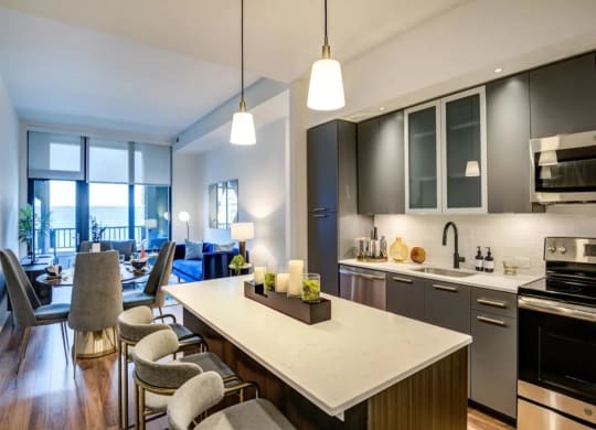 a kitchen and living room in an apartment at The Boro, Tysons, VA 22102