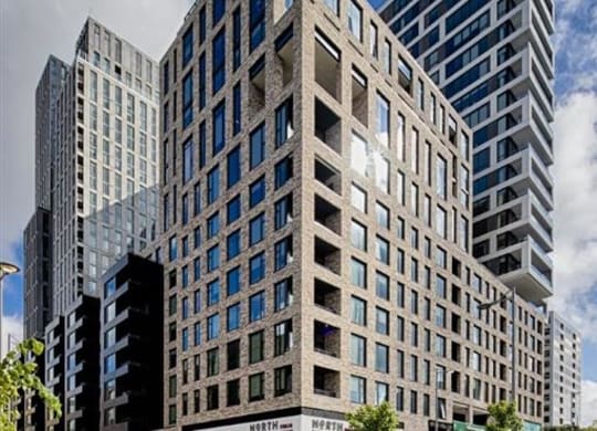 a tall building with a street in front of it at The Boro, Tysons Virginia
