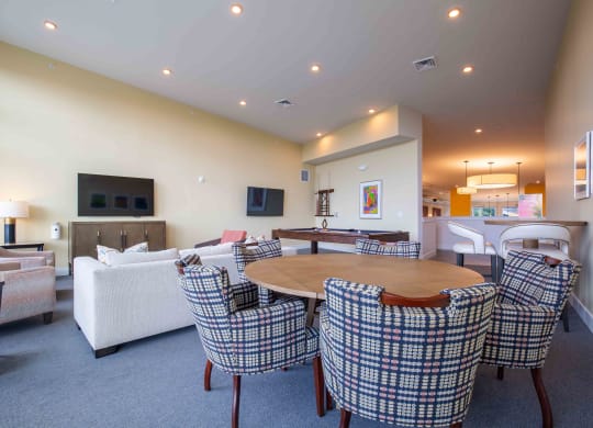 a living room with a pool table and a flat screen tv  at Woodmore Grand, Maryland, 20721