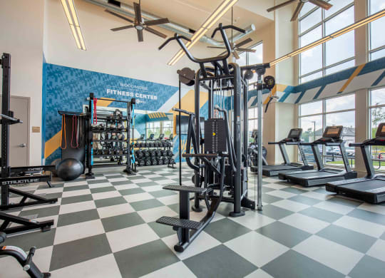 a gym with weights and cardio equipment at Woodmore Grand, Bowie, Maryland