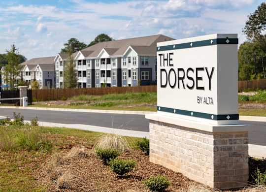 The sign for The Dorsey by Alta is in front of a building.