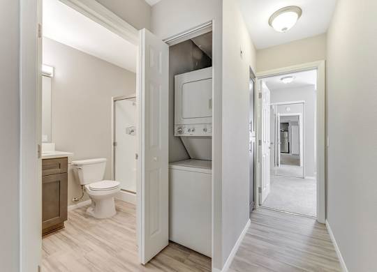Washer and dryer and hallway at Santee Villas, Santee