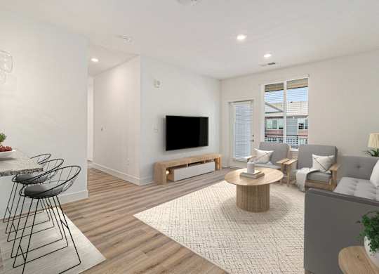 A modern living room with a television, sofas, and a dining table.