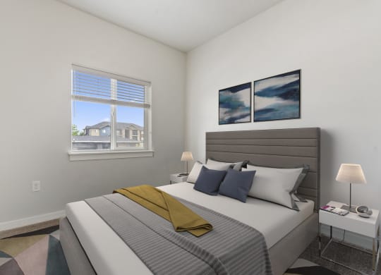 a bedroom with a large bed and a large window
