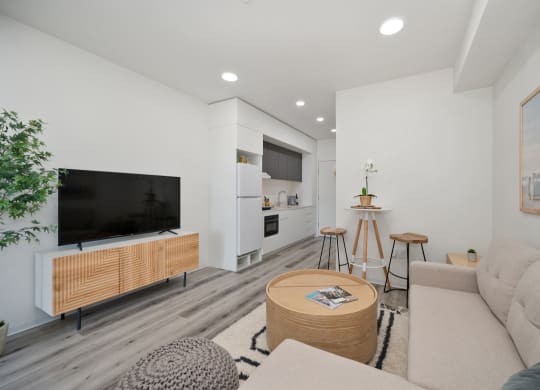 a living room with a couch and a table and a television