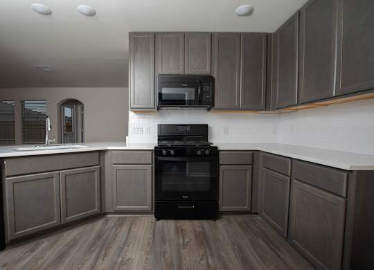 Elegant Backsplashes In Kitchen at The Village at Caney Mills, Texas, 77303