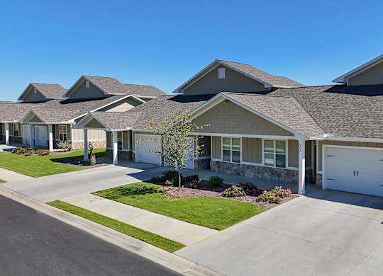 Row of houses with garages at The Ridge at Calhoun, Calhoun, 30701