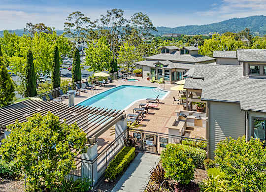 a view of the pool at the resort on a sunny day