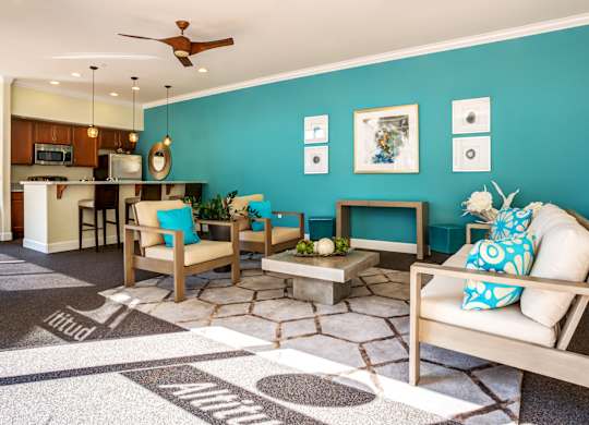 A living room with a white couch and a rug with the word