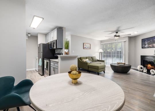 our apartments offer a living room with a dining table and a kitchen at View at Lake Lynn, Raleigh, NC 27613
