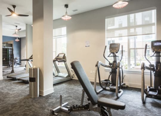 the gym at the district flats apartments in lenexa