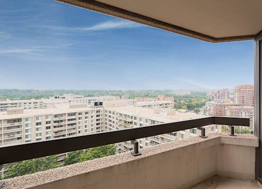 a balcony with a view of the city