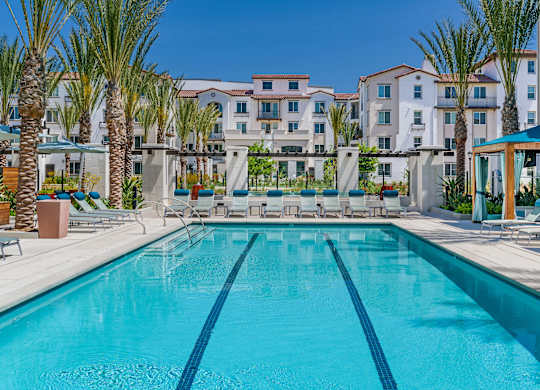 A large swimming pool in front of a resort at Sola at Pacific Highlands Ranch Apartments, San Diego