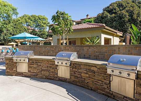 A wall of grills at Legacy Apartments