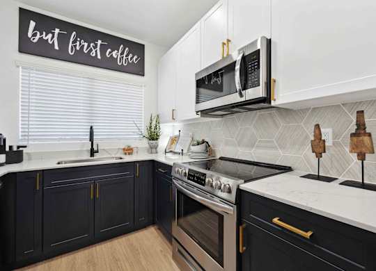 A kitchen with a sign that says