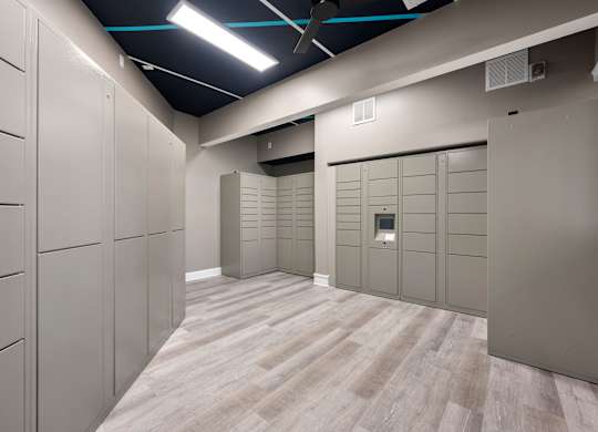 a row of lockers in a room with wood floors