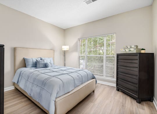 a bedroom with a bed and a dresser at Mariners Crossing, North Carolina