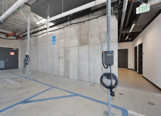 a view of a parking garage with parking meters