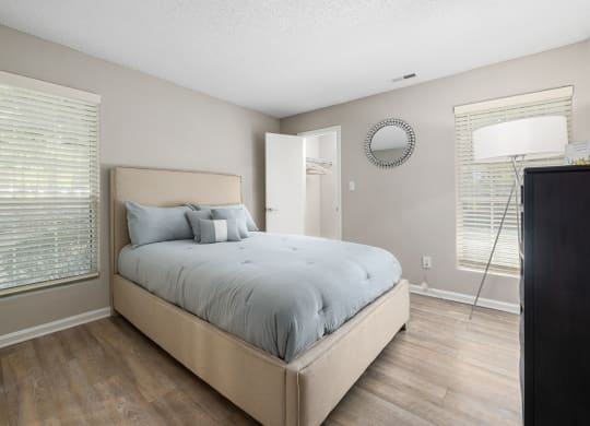 a bedroom with a large bed and a window at View at Lake Lynn, Raleigh, 27613