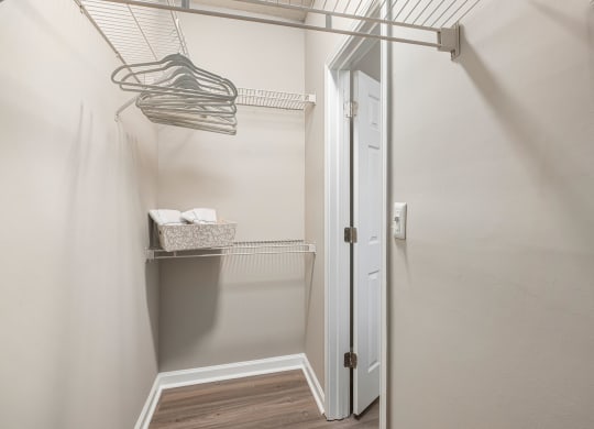 a walk in closet with a glass shower door and a hanging rack at Mariners Crossing, North Carolina, 27612