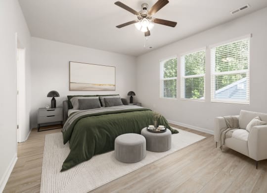 an open bedroom with a bed and a ceiling fan