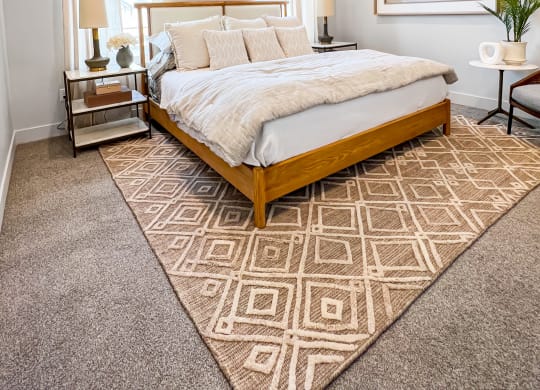 a bedroom with a bed and a ceiling fan