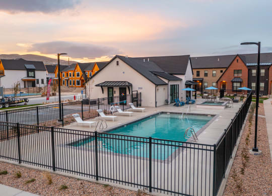 our apartments have a swimming pool and a patio with chairs