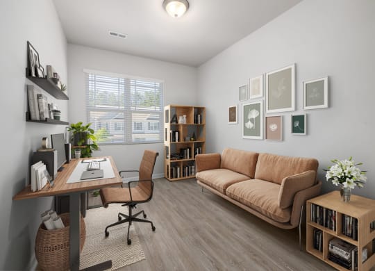 a living room with a couch and a desk